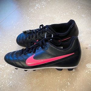 Girls black & hot pink Nike cleats for soccer